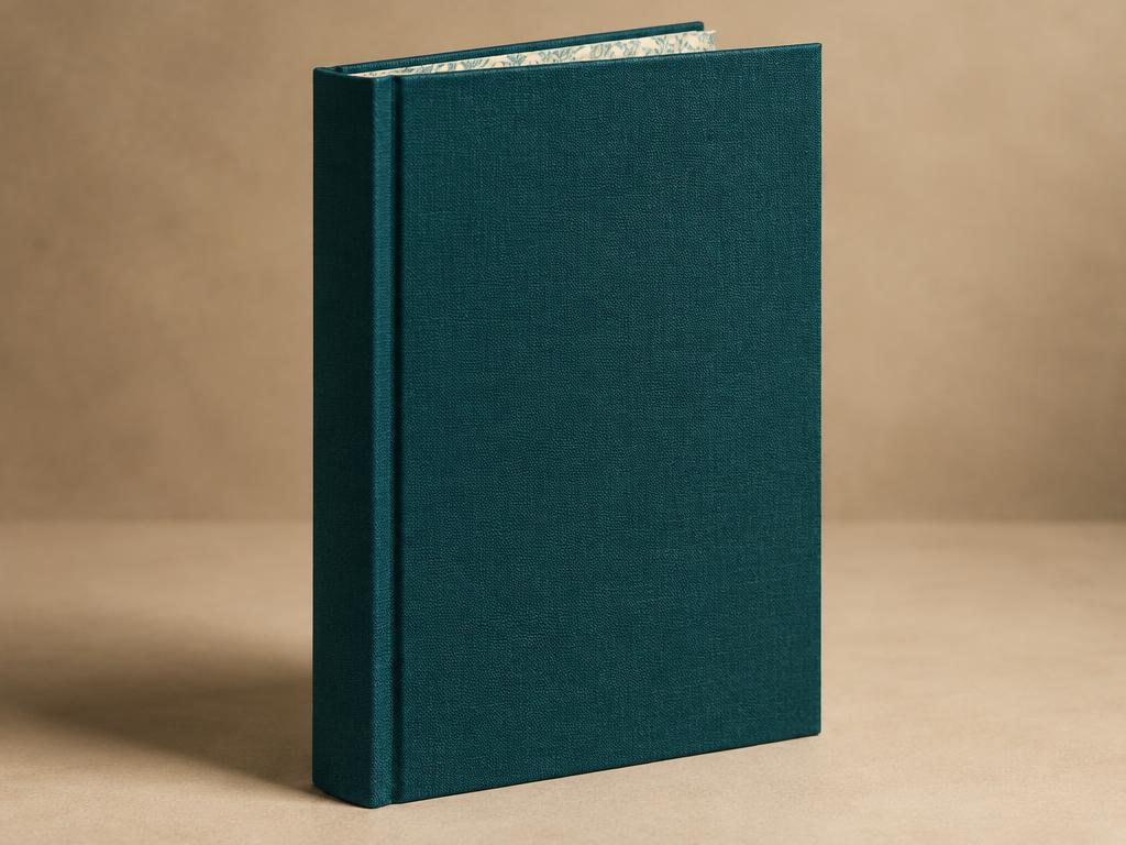Cloth-bound hardcover book standing upright with a squared spine